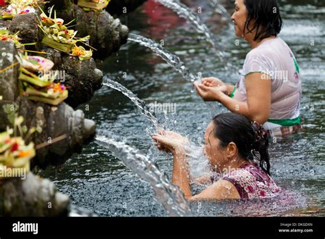 Ritual Washing In The Water Basin Of The Temple Tirtha Emphul On Bali