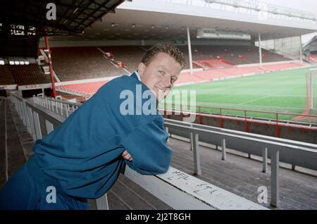 Liverpool Football Player Steve Nicol Poses In The Kop Stand At Anfield