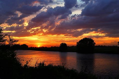 Sunset On The River Photograph By Lynn Hopwood Fine Art America