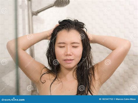 Young Beautiful And Happy Asian Chinese Woman Taking A Shower In The Bathroom Washing Her Hair