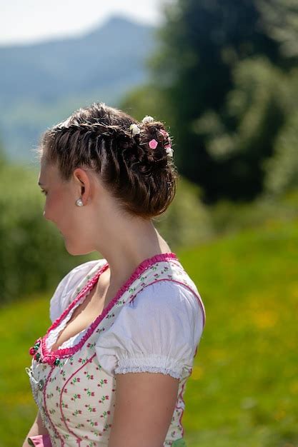Premium Photo Portrait Of A Bavarian Girl In A Dirndl With Braided