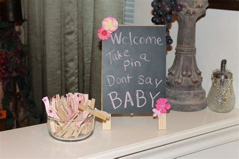 What to say in a baby card. Don't say Baby! | Place card holders, Place cards, Baby shower