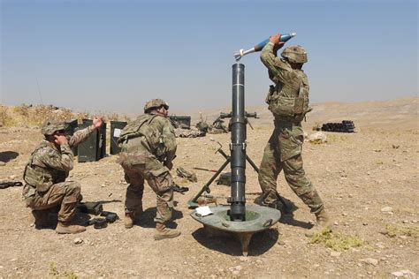 Soldiers Assigned To The 327th Infantry Regiment Conduct Mortar