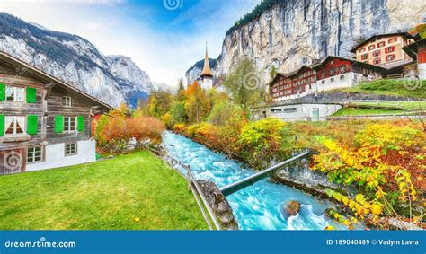 Stunning Autumn View Of Lauterbrunnen Village With Awesome Waterfall