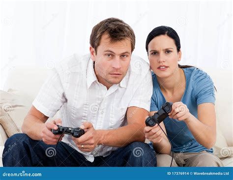 Concentrated Couple Playing Video Games Together Stock Images Image