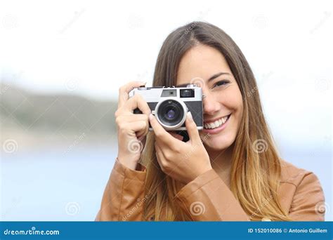 Happy Photographer Taking Photo With A Vintage Camera Stock Photo