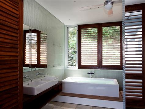 Water resistant bathroom shutters, made to measure from appeal home shading. Contemporary Bathroom With Wood Plantation Shutters | HGTV