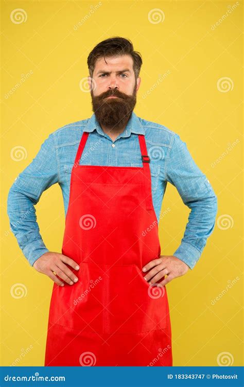 Bearded Man In Cook Uniform Mature Shop Assistant Chef In Red Apron Restaurant Staff Cooking