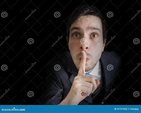 Young Man Is Showing Be Quiet Gesture View From Above Stock Photo