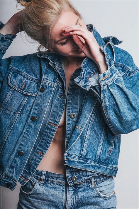 Blonde Woman Smiling And Posing In Denim Jacket And Jeans By Stocksy