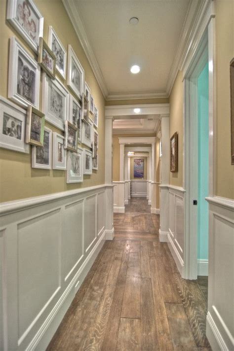 A beige or gray neutral with a slightly green undertone (rather than fleshy peach or pink, which i suspect she meant by beige/earthy tan) on all the walls in this space. Wall Gallery with Layered Silver & White Frames on a Khaki ...