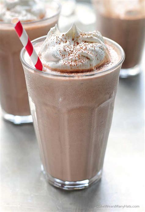 Chocolate ice cream, reese's peanut butter cup oreos and mini reese's peanut butter cups combine to create a delicious peanut butter cup milkshake. Peanut Butter Chocolate Milkshake Recipe | She Wears Many Hats