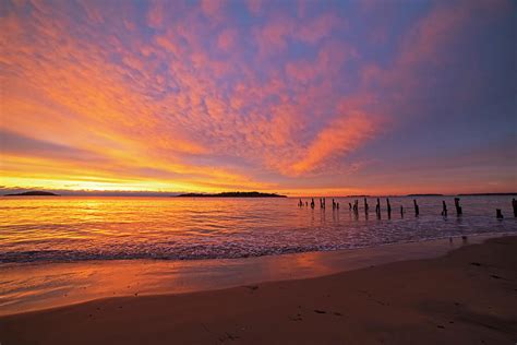 West Beach Sunrise Over The Pilings Beverly Massachusetts Photograph By