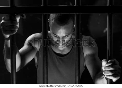 African American Man Behind Bars Stock Photo Edit Now 736585405