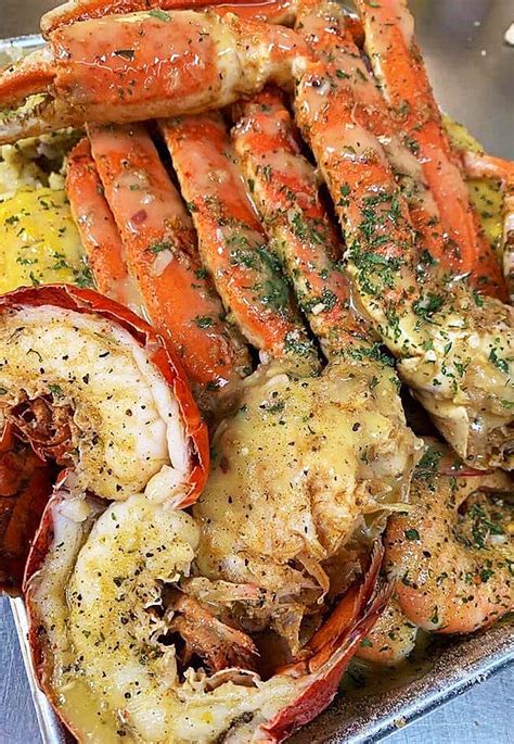 King Crab Legs Lobster And Shrimp Smothered In Garlic Butter Sauce