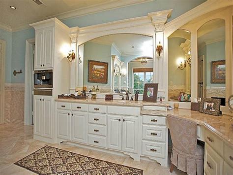 A double trough sink bathroom vanity has basins recessed directly into its countertop, making it an easy clean option. Spacious master bathroom with alcove tub and corner double sink vanity - Marina Interiors
