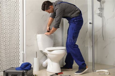 Professional Plumber Working With Toilet Bowl Stock Photo Image Of