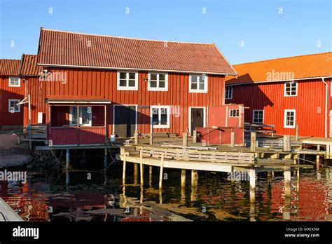 Old Wooden Buildings In The Harbor District Of The Seaside Village Of