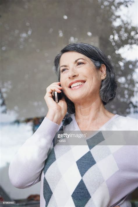 Woman Using Cell Phone High Res Stock Photo Getty Images