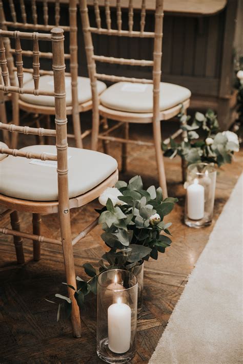 Sage green wedding - aisle decoration with eucalyptus and white candles