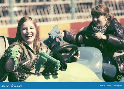 Happy Teen Girls Driving A Bumper Cars Stock Photo Image Of
