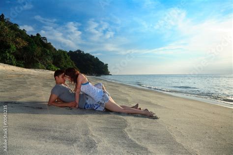 Young Romantic Couple Making Out On Secluded Beach Stock Photo Adobe