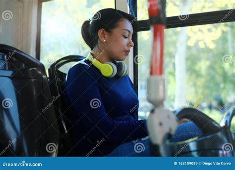 Woman With Headphones Listening To Music Commuting By Bus Stock Image Image Of Beautiful