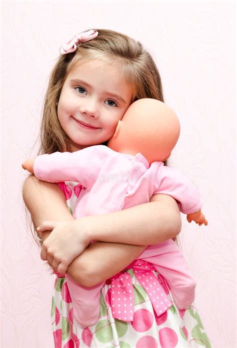 Cute Little Girl Holding And Embracing Her Doll Stock Image Image Of