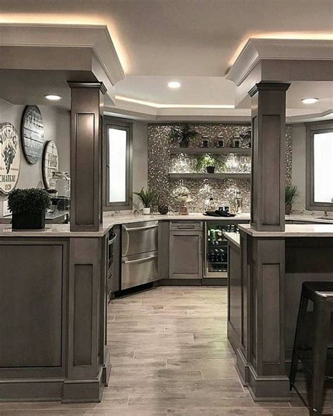 A Kitchen With Gray Cabinets And Counter Tops