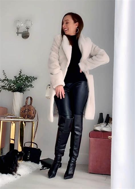 sydne style shows how to wear leather pants with a faux fur coat and over the knee boots see