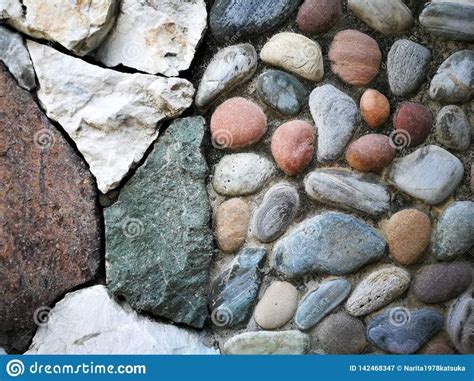 Photo About A Stone Multiple Color That Is Attached To The Wall Image
