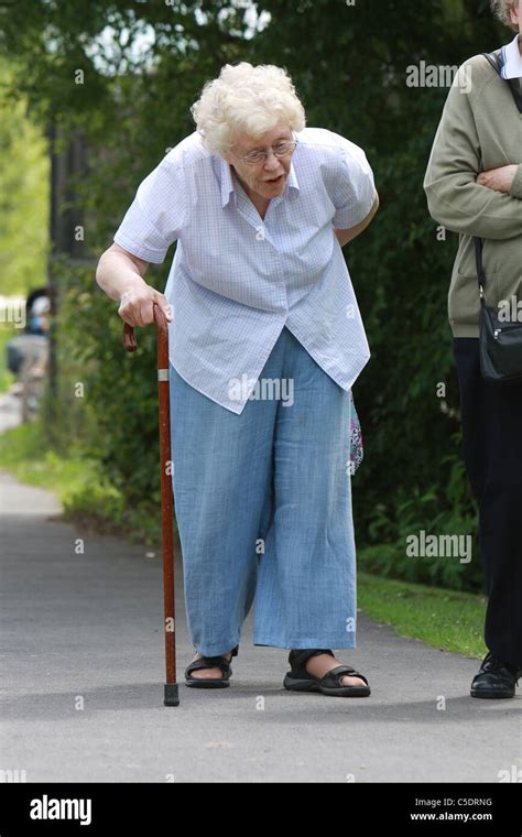 Old Woman Walking With Cane