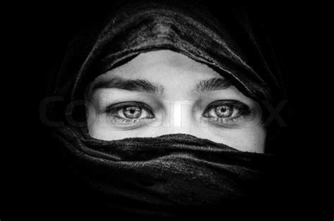 Portrait Of Beautiful Woman With Blue Eyes Wearing Black Scarf In Black And White Stock Photo