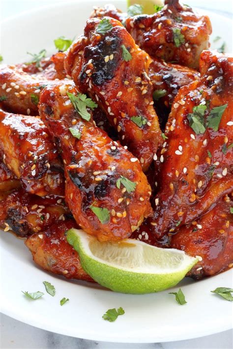 Air frying chicken wings make the most crispy wings with no oil required. Sweet and Spicy Sriracha Baked Chicken Wings - Baker by Nature