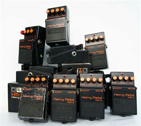 Many Different Effects Pedals Are Stacked On Top Of Each Other In An