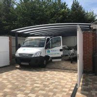 Use our prefab steel carports to cover your car, rv, boat, and more! Garage Attached Double Carport/Work Area Installed in Suffolk | Kappion Carports & Canopies