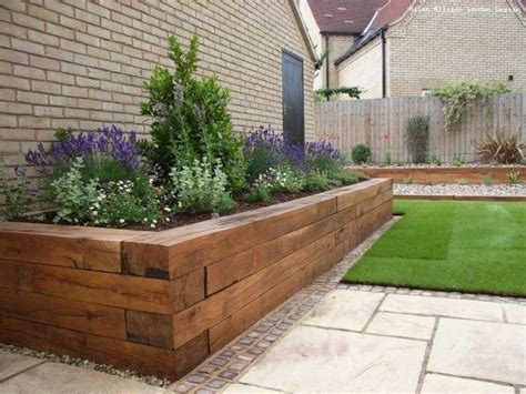 Trade front yard turf for beds of blooms. Raised Flower Bed Idea. #modernyardflowerbeds | Wooden ...
