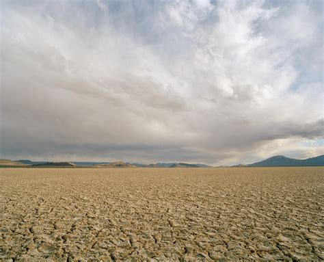 Idaho Desert Dry Lake Bed With Clouds Photograph By Matthias Clamer