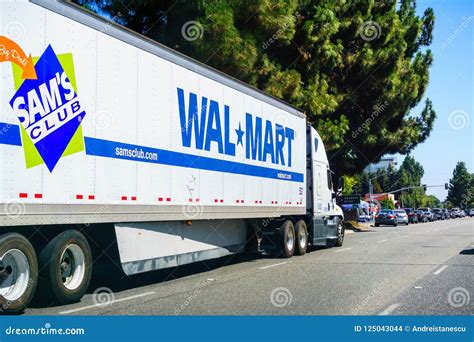 Walmart Trucks Backed In To A Loading Dock In The Back Of The Store
