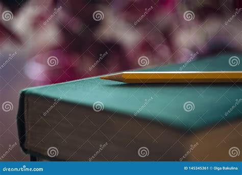 Yellow Pencil On Green Book Concept Of Education Close Up With