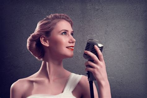 Attractive Female Singer With Microphone Stock Photo By ©khakimullin