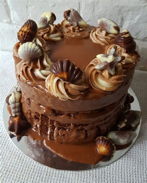 Writing in chocolate takes some skill and lots of practice. Chocolate seashell flood cake www.chic-dreams.co.uk ...