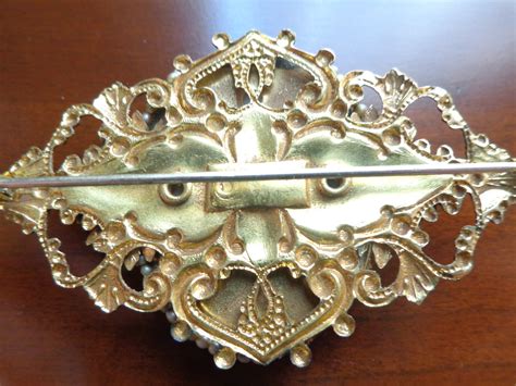 Vintage Costume Jewelry Brooch Stamped Brass And