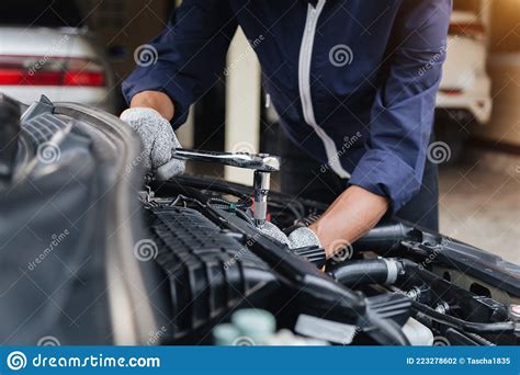 Automobile Mechanic Repairman Hands Repairing A Car Engine Automotive