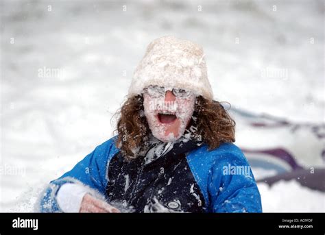 Funny Kid Picture Girl With Face Covered In Snow After Being Hit By