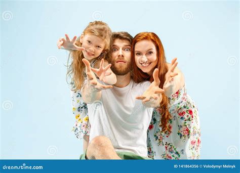 Happy Parent With Daughter At Studio Isolated On Blue Background Stock