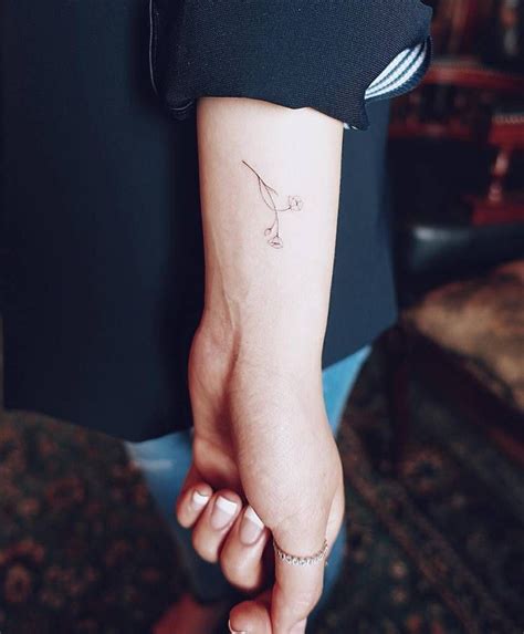 Fine Line Style Flower Tattoo On The Left Wrist Tatto Ideas