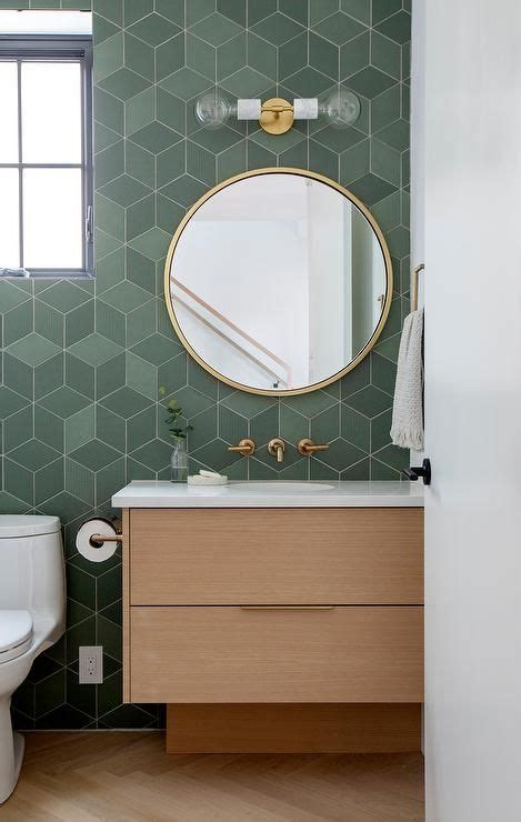 A Glass Dual Globe Sconce Is Fixed In A Brown And Green Powder Room To