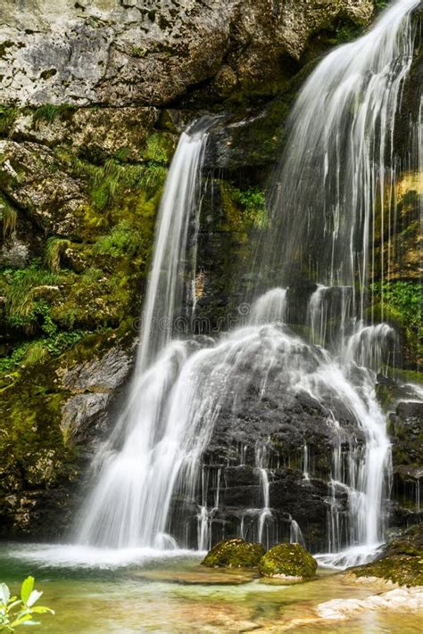 Small Beautiful Waterfall Falling Over Grey Rocks Stock Image Image