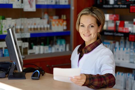 Young Smiling Female Pharmacist Holding Prescription Recruiteze